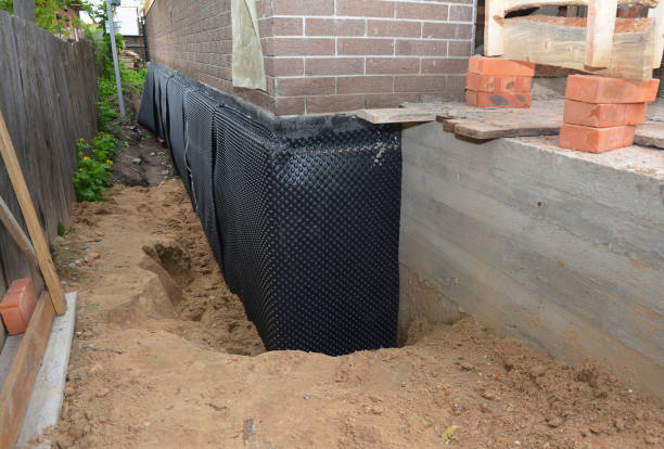 Happy homeowners after waterproofing job in Willard